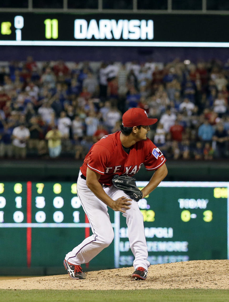 Texas Rangers' Yu Darvish of Japan watches a single by Boston Red Sox's David Ortiz reach outfielder Alex Rios in the ninth inning of a baseball game spoiling a no-hit bid by Darvish, Friday, May 9, 2014, in Arlington, Texas. The Rangers won 8-0. (AP Photo/Tony Gutierrez)