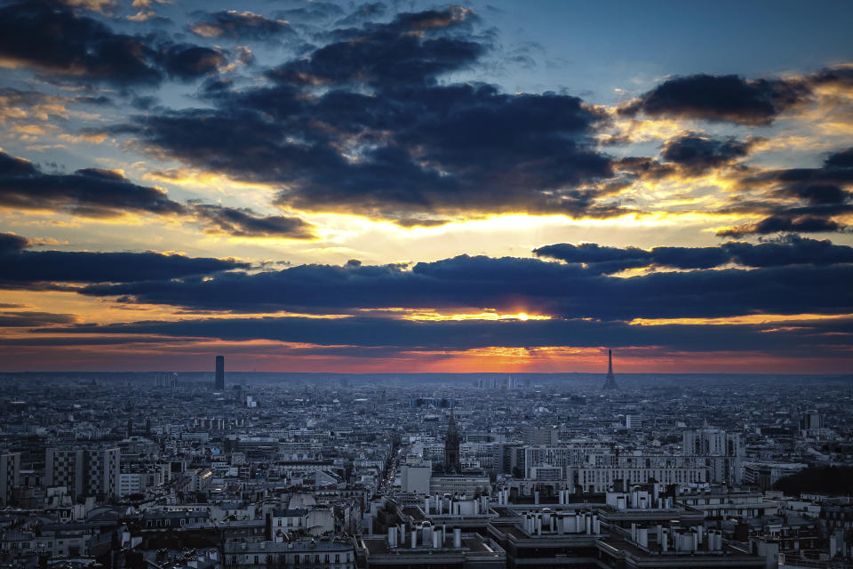 FILE - The Eiffel tower and Montparnasse tower, left, are pictured at sunrise in Paris, France, Tuesday, Feb. 28, 2023. Paris is on track to host millions of visitors and successfully stage 32 sporting events next year when the 2024 Olympics open on July 26. That's a welcome return to business as usual for the first post-pandemic Olympics. (AP Photo/Aurelien Morissard, File)