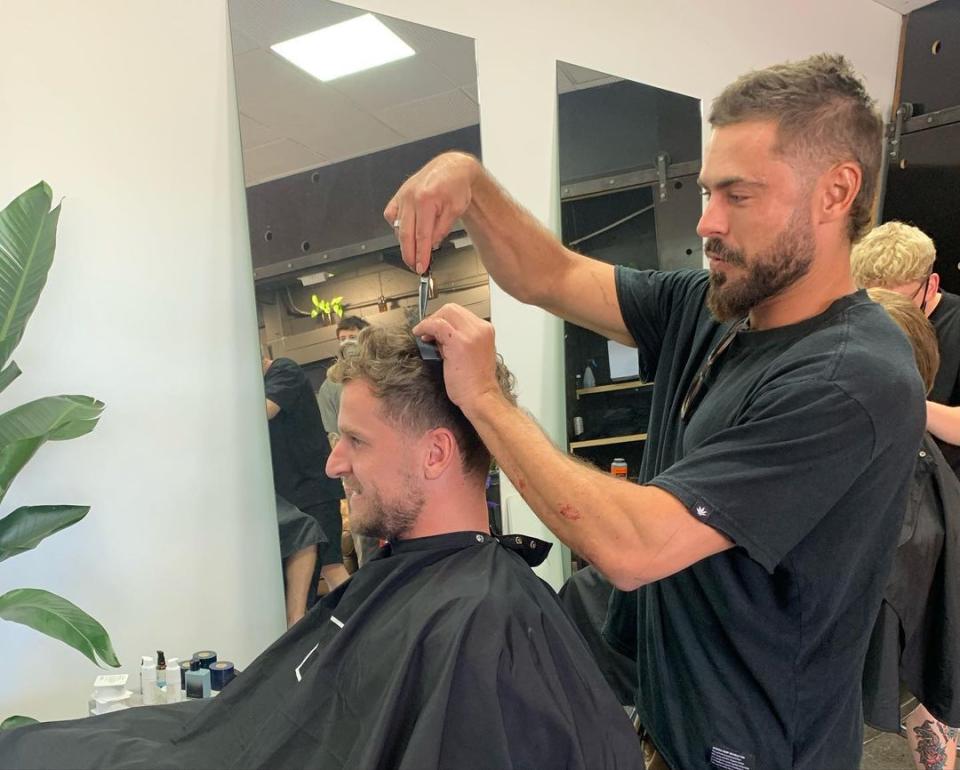 Zac even gave owner Robby Lippett a little trim while he was there. Photo: Instagram/Atta Boy Hair