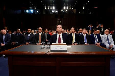 FILE PHOTO: Former FBI Director James Comey testifies before a Senate Intelligence Committee hearing on Russia's alleged interference in the 2016 U.S. presidential election on Capitol Hill in Washington, U.S., June 8, 2017. REUTERS/Jonathan Ernst