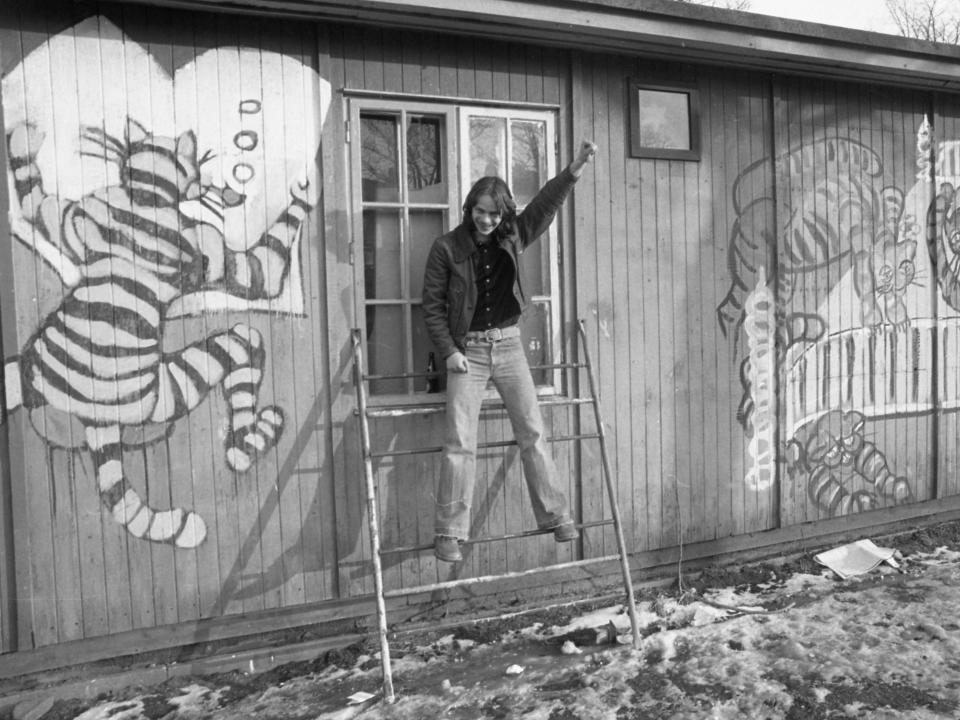 A man raises his fist in 1976 inside Christiania.