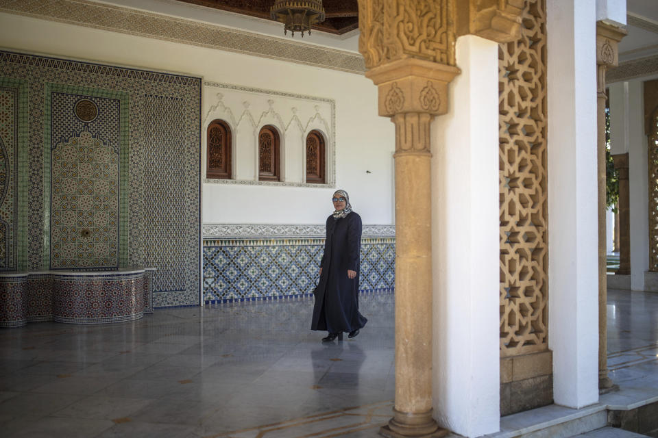 Aziza Moufid, 40, a female Muslim religious guide, or mourchida, poses for a portrait in Lalla Soukaina mosque, named after the daughter of the late King Hassan II, in Hay Riad neighborhood of Rabat, Morocco, Tuesday, Nov. 9, 2021. During the pandemic, Moufid has been using WhatsApp to explain sayings of the Prophet Muhammad to children, to help women learning to memorize and recite the Quran and to counsel teenage girls. (AP Photo/Mosa'ab Elshamy)