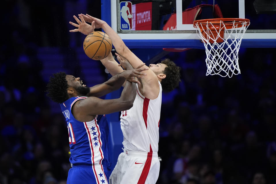 Philadelphia 76ers' Joel Embiid, left, cannot get a shot past Houston Rockets' Alperen Sengun during the second half of an NBA basketball game, Monday, Jan. 15, 2024, in Philadelphia. (AP Photo/Matt Slocum)