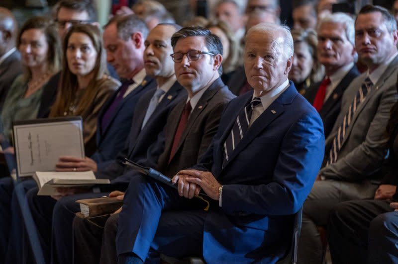 President Joe Biden (C), with Speaker of the House Mike Johnson and House Minority Leader Hakeem Jeffries, listens to Italian tenor Andrea Bocelli during the National Prayer Breakfast in Statuary Hall on Thursday. Photo by Shawn Thew/UPI