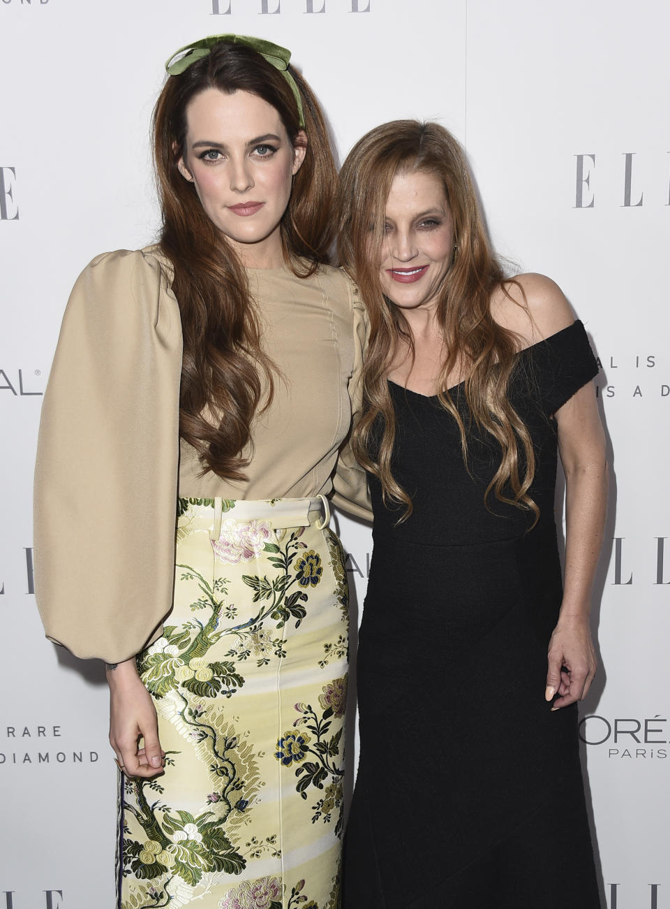 FILE - Riley Keough, left, and her mother Lisa Marie Presley arrive at the 24th annual ELLE Women in Hollywood Awards on Oct. 16, 2017, in Los Angeles. Presley, singer and only child of Elvis, died Thursday, Jan. 12, 2023, after a hospitalization, according to her mother, Priscilla Presley. She was 54. (Photo by Jordan Strauss/Invision/AP, File)