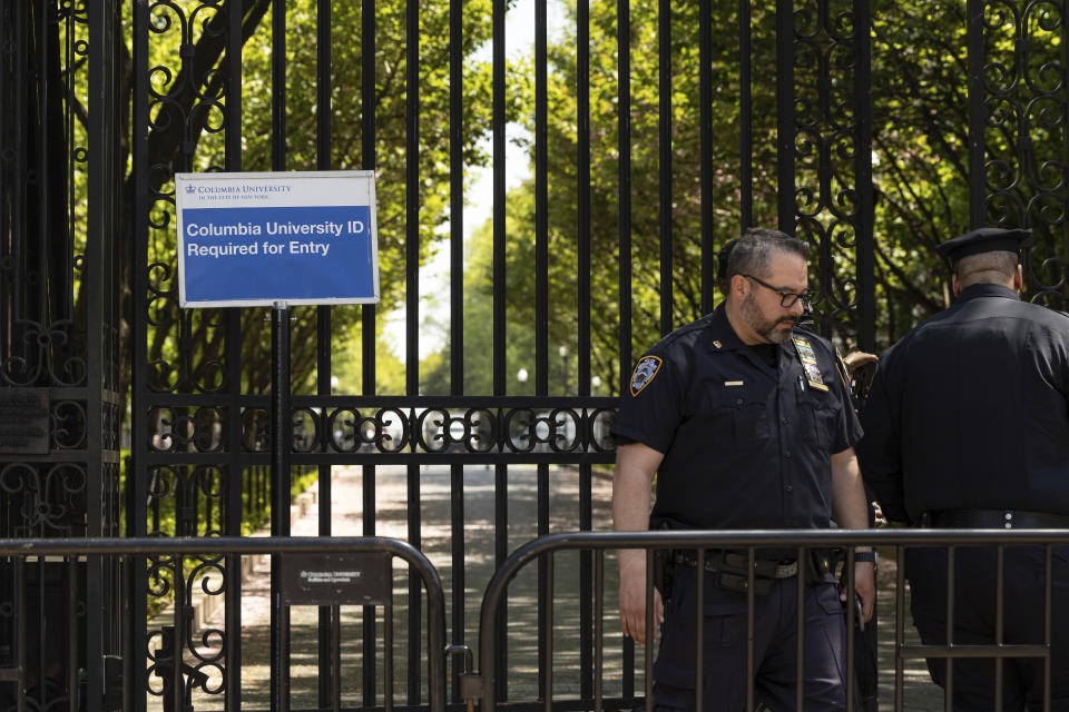 FILE - Police officers stand guard outside Columbia University, Thursday, May 2, 2024, in New York. Colleges and universities have long been protected places for free expression without pressure or punishment. But protests over Israel's conduct of the war in Gaza in its hunt for Hamas after the Oct. 7 massacre has tested that ideal around the world. (AP Photo/Yuki Iwamura, File)