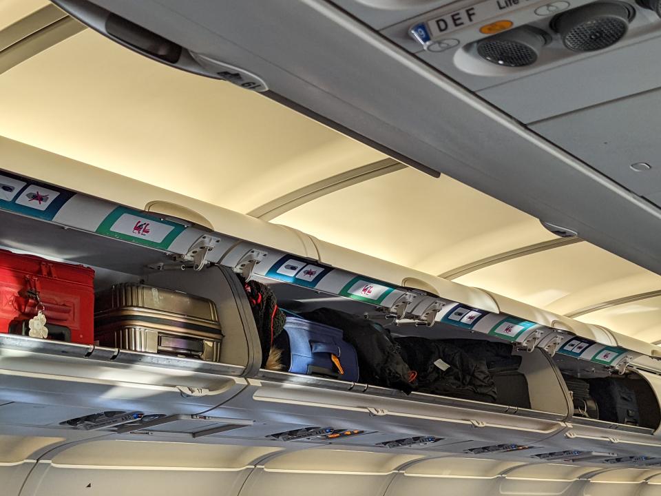 Overhead bins on plane.