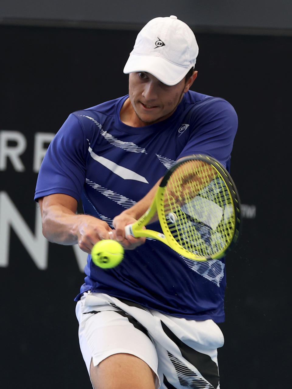 Serbia's Miomir Kecmanovic makes a backhand return to Russia's Daniil Medvedev during their Round of 16 match at the Adelaide International Tennis tournament in Adelaide, Australia, Wednesday, Jan. 4, 2023. (AP Photo/Kelly Barnes)