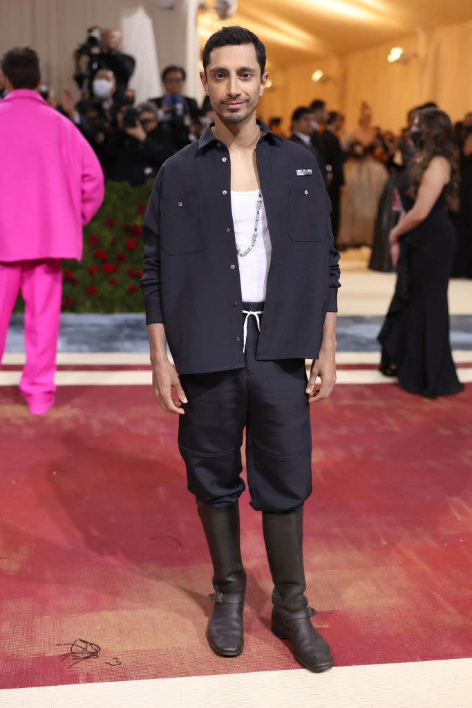 Riz Ahmed smiling on the red carpet