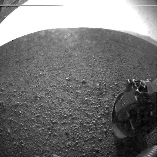This is one of the first images taken by NASA's Curiosity rover, which landed on Mars the evening of Aug. 5 PDT (morning of Aug. 6 EDT). It was taken through a "fisheye" wide-angle lens on the left Hazard-Avoidance camera on the left-rear side