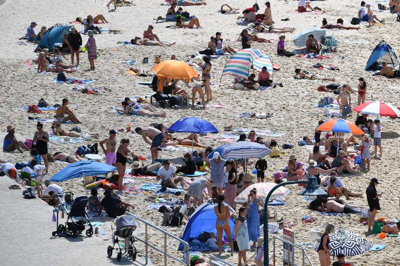 Large crowds of beachgoers are seen at Bronte Beach Sydney.