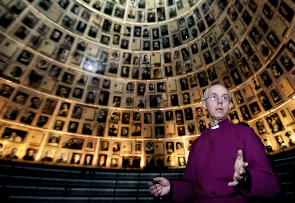 Britain's Archbishop of Canterbury Justin Welby, visits the Hall of Names at the Yad Vashem Holocaust memorial in Jerusalem, Thursday, June 27, 2013. (AP Photo/Sebastian Scheiner)