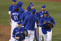 Toronto Blue Jays celebrate a 5-2 win over the Baltimore Orioles in a baseball game Saturday, Sept. 26, 2020, in Buffalo, N.Y. (AP Photo/Jeffrey T. Barnes)