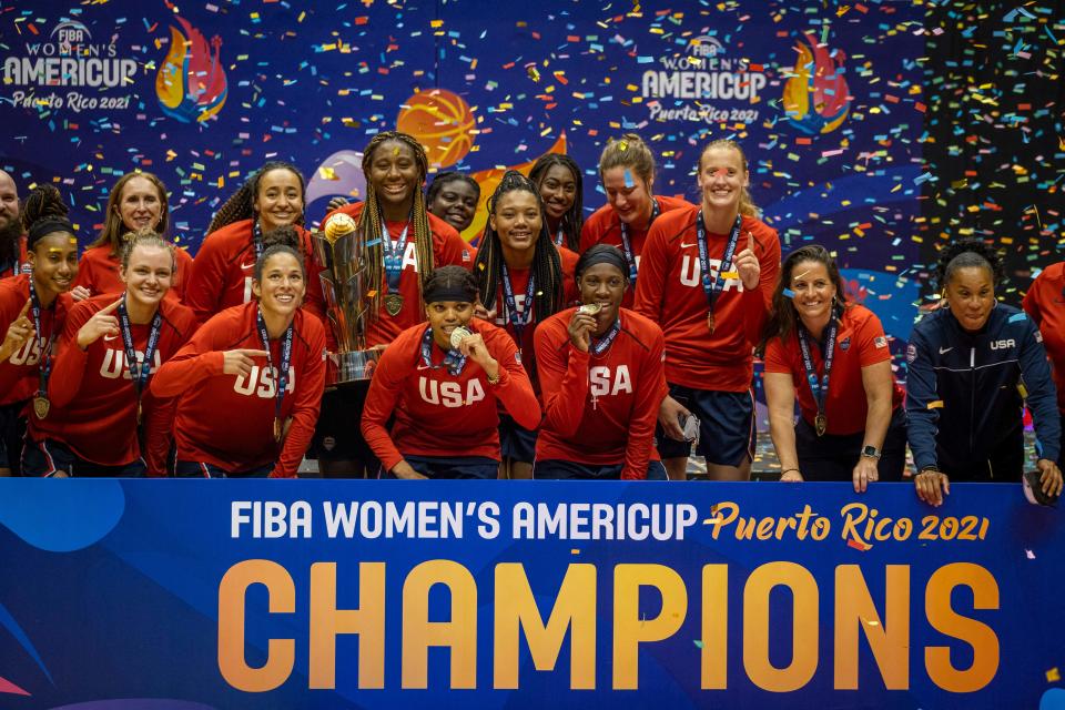 The U.S. women's basketball team celebrates its AmeriCup gold medal victory.  (Photo by RICARDO ARDUENGO/AFP via Getty Images)