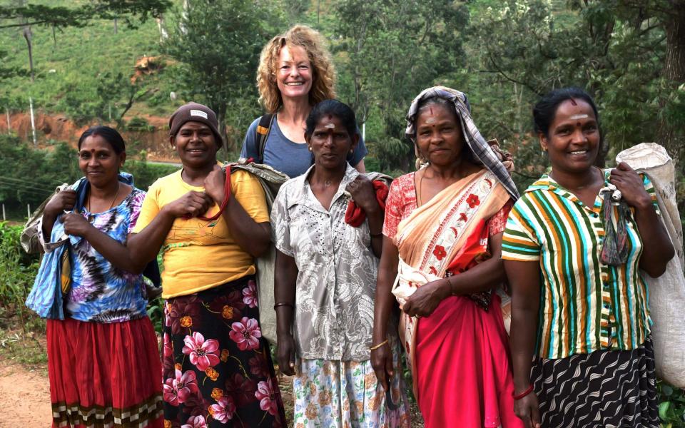 Writer Kate with workers on the tea plantation