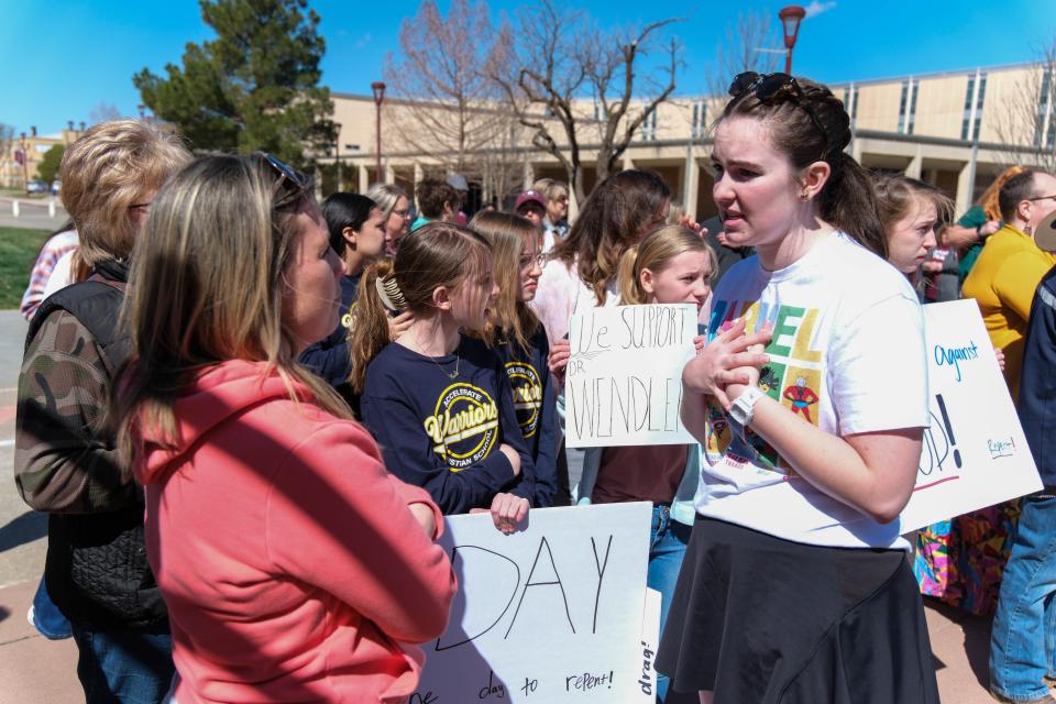 A student talks with a counter-protester Friday at WT at a drag show protest in Canyon.