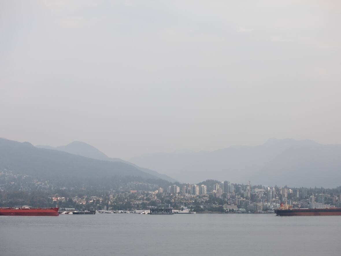 Poor air quality, caused by wildfires in this photo from late September, can be seen over North Vancouver. On Tuesday, Metro Vancouver issued an air quality advisory for eastern parts of the Fraser Valley, largely as a result of wildfires burning in the area. (Justine Boulin/CBC - image credit)