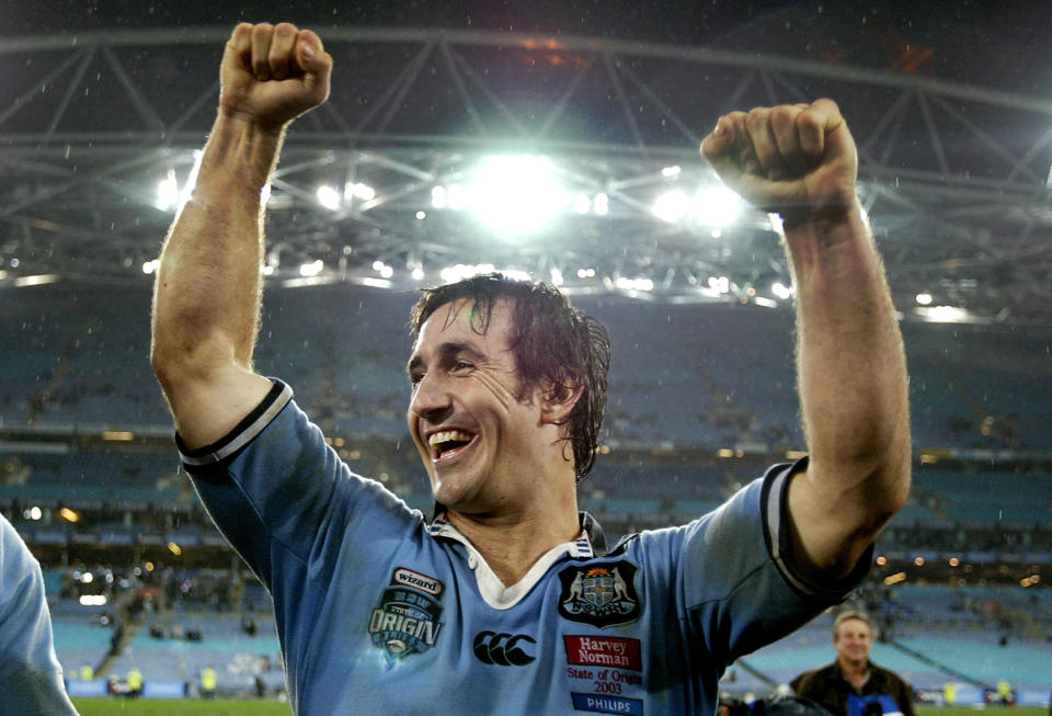 Andrew Johns (pictured) celebrates victory after Game 2 of the NRL State of Origin Series in 2003.