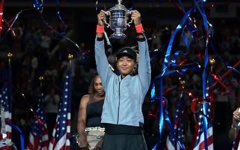 Naomi Osaka of Japan with trophy after winning against Serena Williams of the US during their Women's Singles Finals match at the 2018 US Open at the USTA Billie Jean King National Tennis Center in New York on September 8, 2018. - Osaka, 20, triumphed 6-2, 6-4 in the match marred by Williams's second set outburst, the American enraged by umpire Carlos Ramos's warning for receiving coaching from her box. She tearfully accused him of being a "thief" and demanded an apology from the official - Credit: AFP