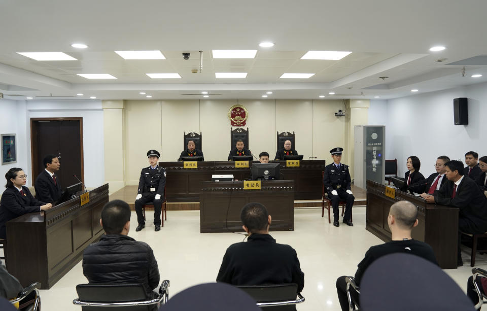 A trial continues as fentanyl drug traffickers are sentenced in court, Thursday, Nov. 7, 2019, in Xingtai, north China's Hebei Province. The court sentenced at least nine fentanyl traffickers Thursday in a case that was a culmination of a rare collaboration between Chinese and U.S. law enforcement to crack down on global networks that manufacture and distribute lethal synthetic opioids. (Jin Liangkuai/Xinhua via AP)