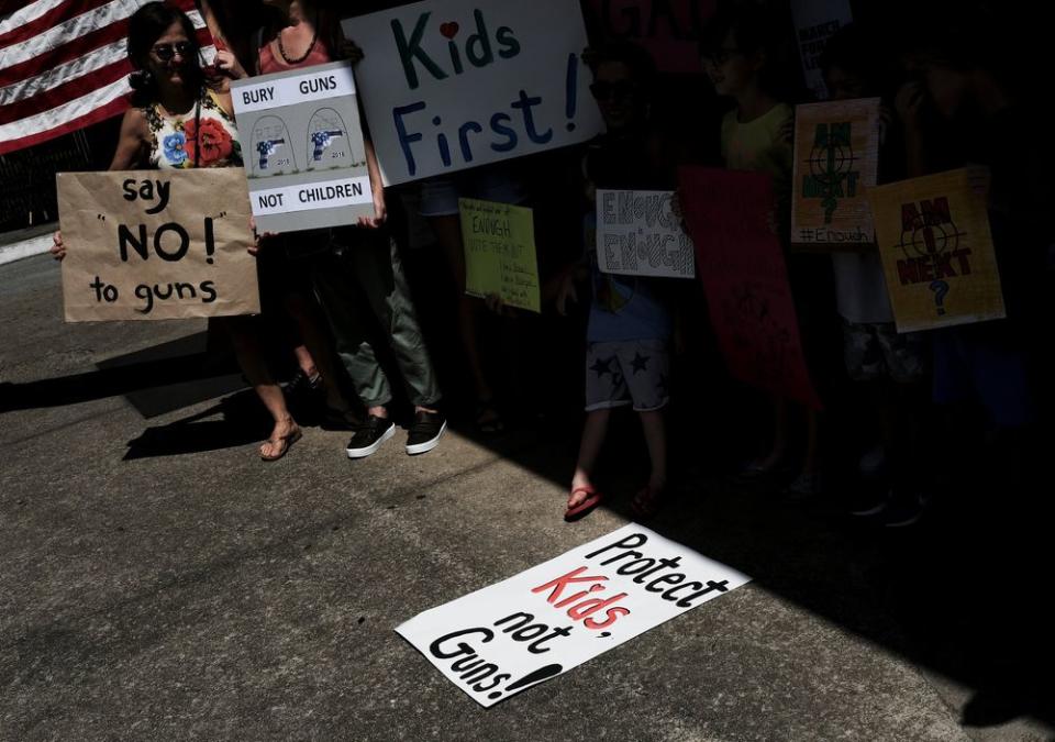 People take part in the March for Our Lives demonstration to end gun violence outside the U.S. Consulate in Sao Paulo, Brazil.