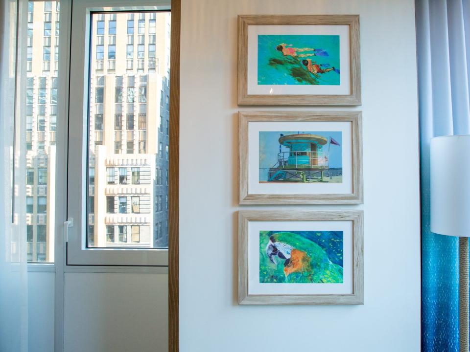 three panels of wall art displaying beach-like tropical imagery