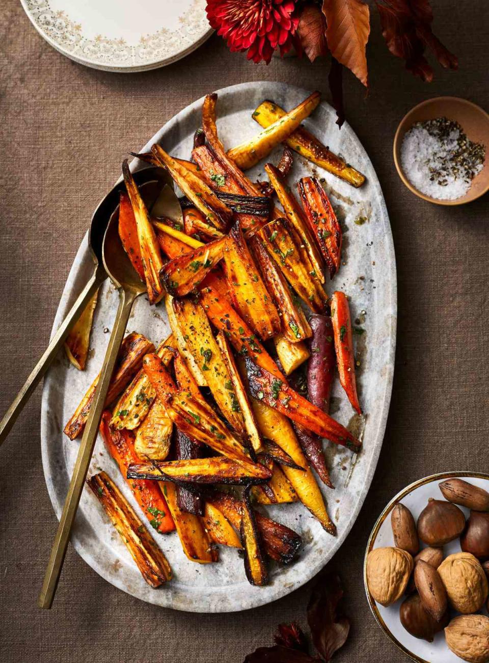 <p><strong>Recipe: <a href="https://www.southernliving.com/recipes/roasted-carrots-and-parsnips" rel="nofollow noopener" target="_blank" data-ylk="slk:Roasted Carrots and Parsnips;elm:context_link;itc:0;sec:content-canvas" class="link ">Roasted Carrots and Parsnips</a></strong></p> <p>If your family likes sweet potatoes, you can add them to the mix as well. </p>