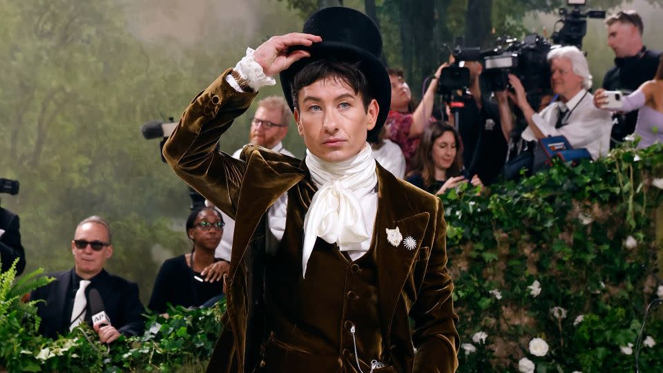 Barry Keoghan's Burberry suit came with a satin necktie, top hat and three watches. - Taylor Hill/Getty Images