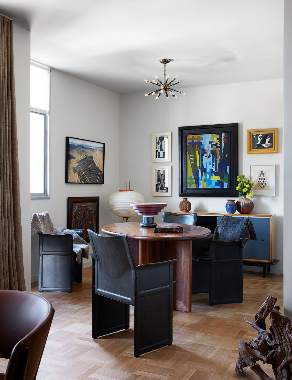 Johanknecht’s dining area features vintage Matteo Grassi chairs and a custom walnut table. Ettore Sottsass ceramic vase.