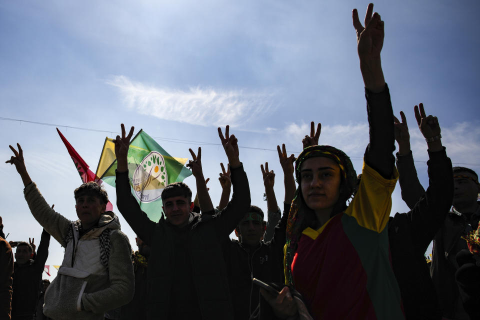 Supporters of pro-Kurdish Peoples' Equality and Democracy Party (DEM Party) chant slogans during the Newroz celebrations, in Istanbul, Turkey, Sunday, March 17, 2024. On Sunday, millions of voters in Turkey head to the polls to elect mayors and administrators in local elections which will gauge President Recep Tayyip Erdogan’s popularity as his ruling party tries to win back key cities it lost five years ago. (AP Photo/Emrah Gurel)
