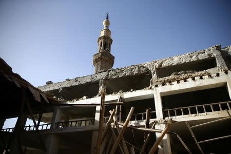 A damaged mosque is seen in the besieged town of Douma in eastern Ghouta in Damascus, Syria, March 1, 2018. REUTERS/ Bassam Khabieh