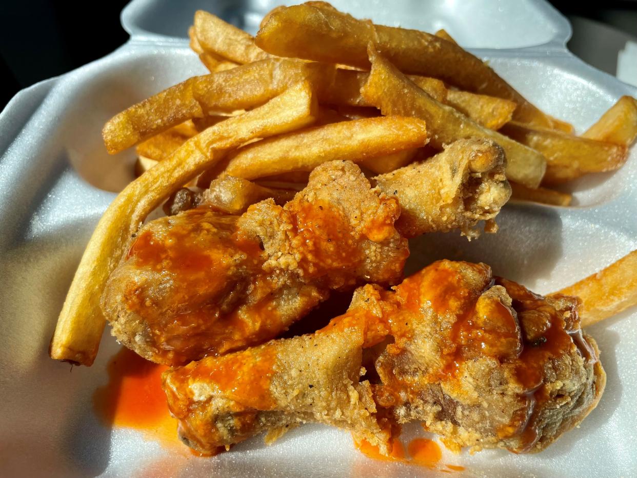 Two chicken legs and fries from Crouch's (aka Gas N Snack) in Fort Myers.