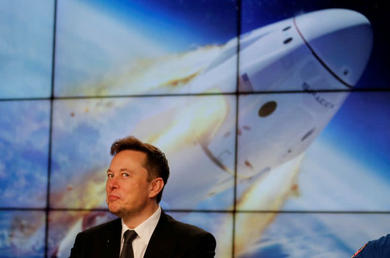 FILE PHOTO: SpaceX founder and chief engineer Elon Musk reacts during a post-launch news conference to discuss the SpaceX Crew Dragon astronaut capsule in-flight abort test at the Kennedy Space Center