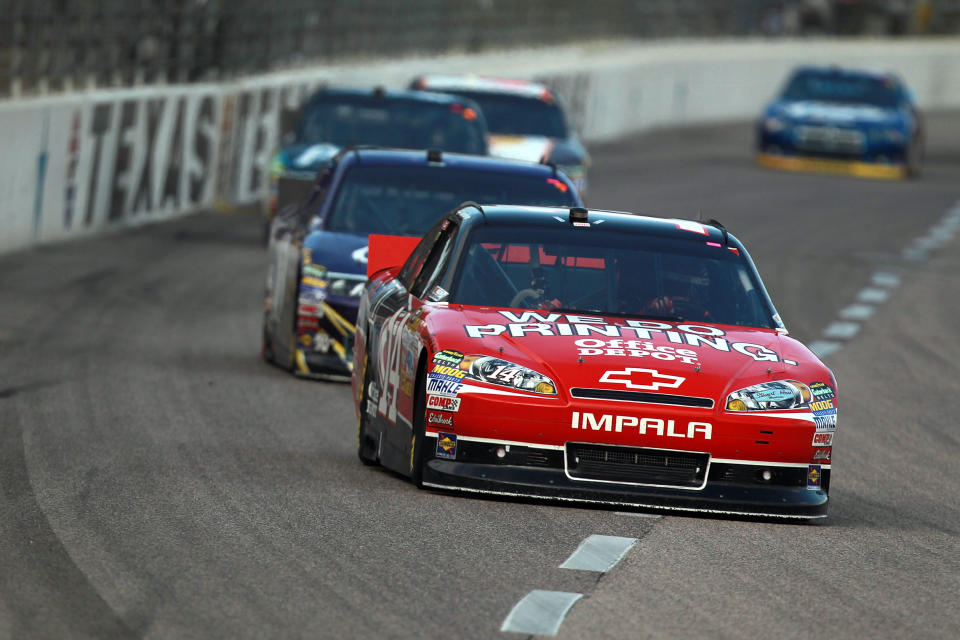 FORT WORTH, TX - NOVEMBER 06: Tony Stewart, driver of the #14 Office Depot/Mobil 1 Chevrolet, leads a pack of cars during the NASCAR Sprint Cup Series AAA Texas 500 at Texas Motor Speedway on November 6, 2011 in Fort Worth, Texas. (Photo by Ronald Martinez/Getty Images)