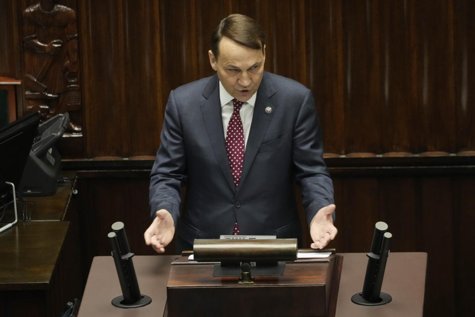 Poland's Foreign Minister Radek Sikorski delivers a speech to the parliament in Warsaw, Poland, Thursday April 25, 2024. Sikorski told the parliament that the government wants to return to the group of countries which sets the agenda of the European Union, laying out the government's vision at a historically crucial moment with war across the border in Ukraine. (AP Photo/Czarek Sokolowski)