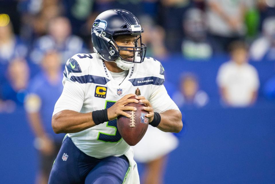 Seattle Seahawks quarterback Russell Wilson passes the ball against the Indianapolis Colts  at Lucas Oil Stadium.