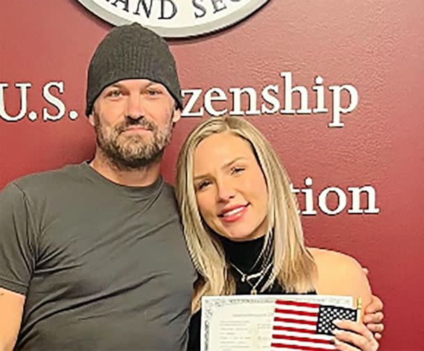 PHOTO: Sharna Burgess with Brian Austin Green after she became a U.S. citizen. (sharnaburgess/Instagram)