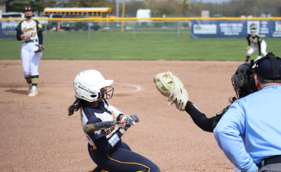 Whiteford Patrina Marsh bends out of the way of an inside pitch against Flat Rock Saturday. Whiteford posted two shutouts to win its own tournament.