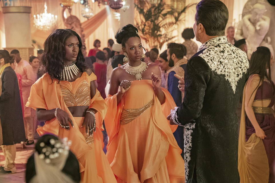 This image released by Netflix shows Jodie Turner-Smith, from left, Zurin Villanueva and Enrique Arce in a scene from the film "Murder Mystery 2." (Scott Yamano/Netflix via AP)