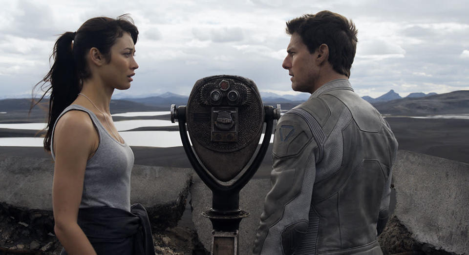 Olga Kurylenko and Tom Cruise in Universal Pictures' "Oblivion" - 2013