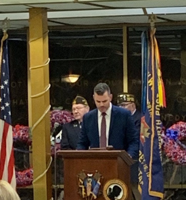 Kenilworth Superintendent of Schools Kyle Arlington speaks at a community Veterans Day event with Commander of VFW Post 2230 Robert E. Jeans Sr. (left) and Kenilworth Veterans Center president Jerry Dobbins.