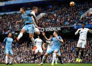 <p>Alfie Mawson of Swansea City heads wide from a corner during the Premier League match between Manchester City and Swansea City at Etihad Stadium on February 5, 2017 in Manchester, England. </p>