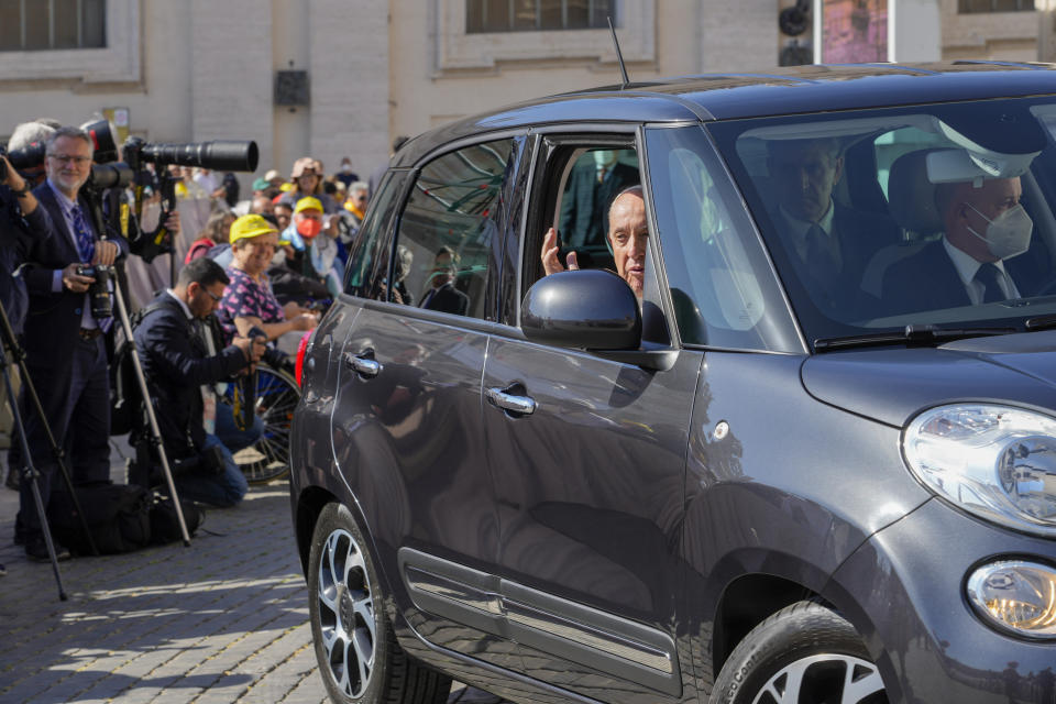 Pope Francis arrives in a car in St. Peter's Square at The Vatican, Sunday, May 15, 2022, to celebrate the canonization mass of nine new saints. (AP Photo Gregorio Borgia)