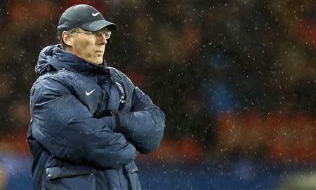 Paris St Germain's coach Laurent Blanc watches as his players face FC Lorient during their French Ligue 1 soccer match at the Parc des Princes Stadium in Paris November 1, 2013. REUTERS/Benoit Tessier