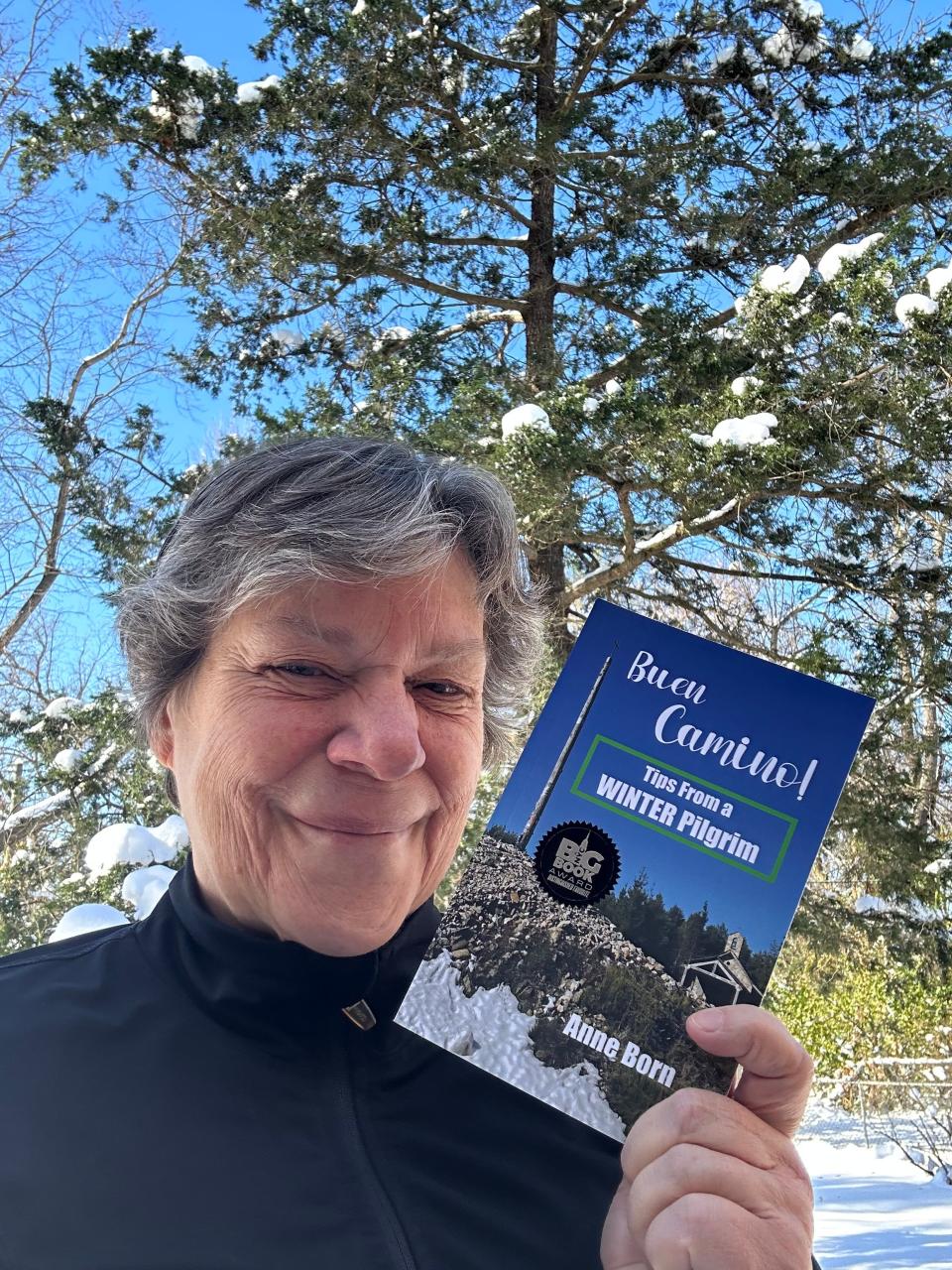 Anne Born is seen near home in Niles with her book "Buen Camino! Tips from a Winter Pilgrim."
