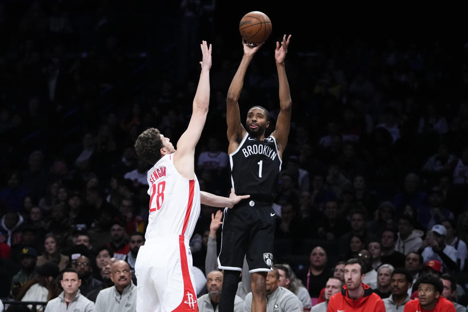 Brooklyn Nets' Mikal Bridges (1) shoots over Houston Rockets' Alperen Sengun (28) during the second half of an NBA basketball game, Wednesday, March 29, 2023, in New York. The Nets won 123-114. (AP Photo/Frank Franklin II)