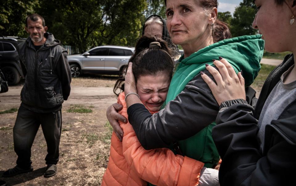 Oksana Velychko, with her tearful daughter Kristina, described the shelling as 'just unbearable for the kids'