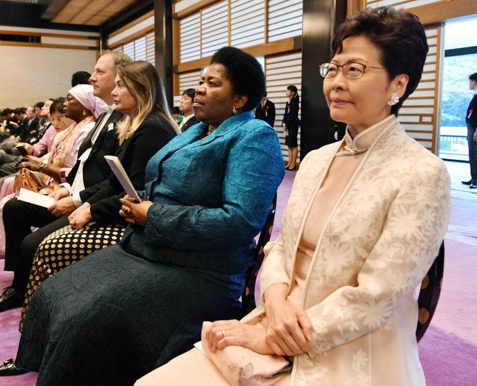 Hong Kong's Chief Executive Carrie Lam attends the enthronement ceremony of Japan's Emperor Naruhito at the Imperial Palace, in Tokyo, Tuesday, Oct. 22, 2019. Japan's Naruhito proclaimed himself Emperor during an enthronement ceremony at the Imperial Palace, declaring himself the country's 126th monarch.(Kyodo News via AP)