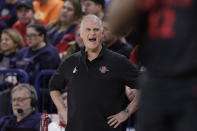 San Diego State head coach Brian Dutcher directs his team during the first half of an NCAA college basketball game against Gonzaga, Friday, Dec. 29, 2023, in Spokane, Wash. (AP Photo/Young Kwak)