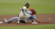 St. Louis Cardinals' Tommy Edman, right, steals second base as Atlanta Braves' Ozzie Albies waits for the ball in the first inning of the first baseball game of a doubleheader Sunday, June 20, 2021, in Atlanta. (AP Photo/Ben Margot)